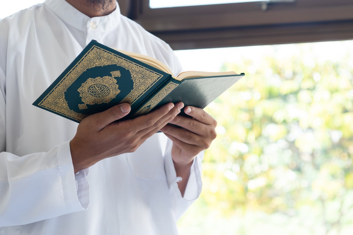 Muslim man in a white jellabah holding and reading the Quran. Islamic religious practice: Reading the Quran. Quranic meditation
meditation
Quran
Islam
spiritual growth
peace
mindfulness
reflection
connection with Allah
muslim prayer journal
gratitude